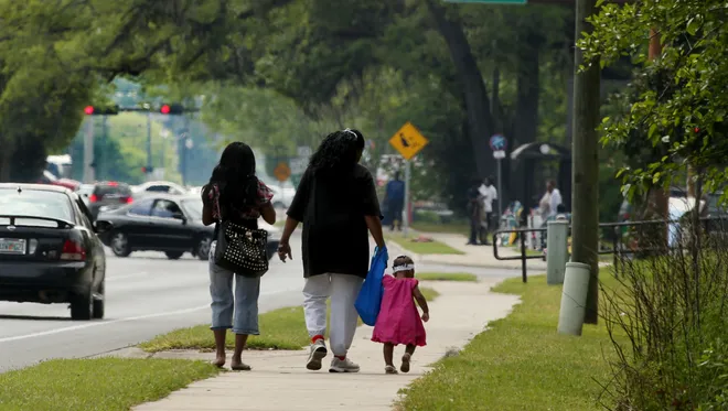 Family Walking Near South City Near Putnam Street